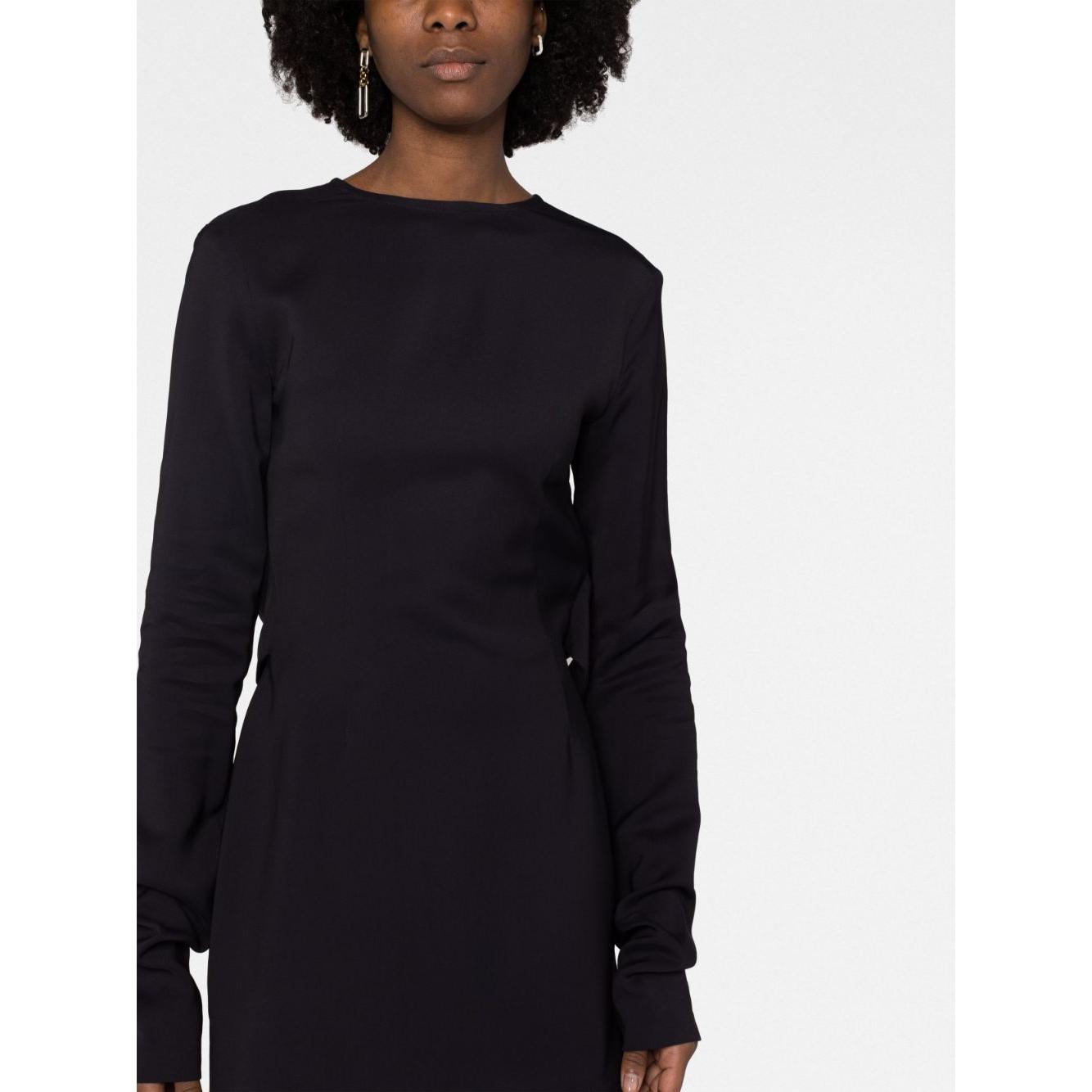 032C black mini dress with long sleeves and round neck featuring cut-out details and rear zip fastening, modeled by woman.