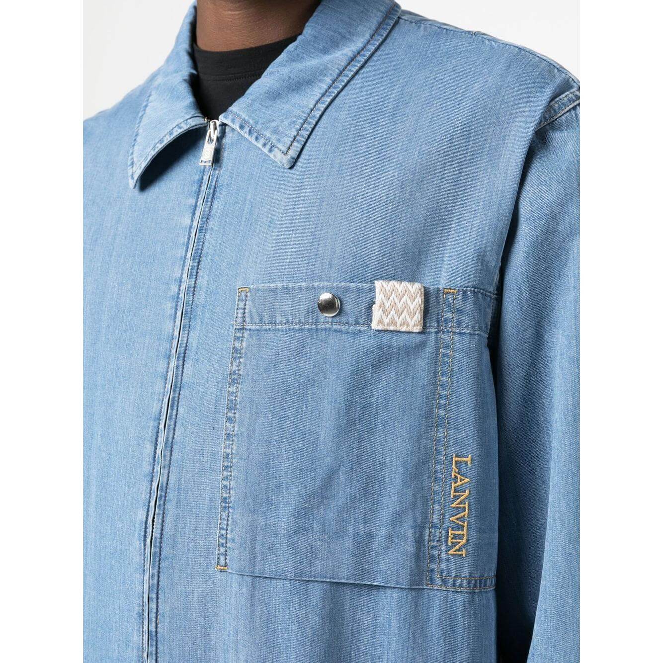 Alt Tag: Lanvin light blue denim zip-up shirt with embroidered logo, classic collar, and patch pocket detail.
