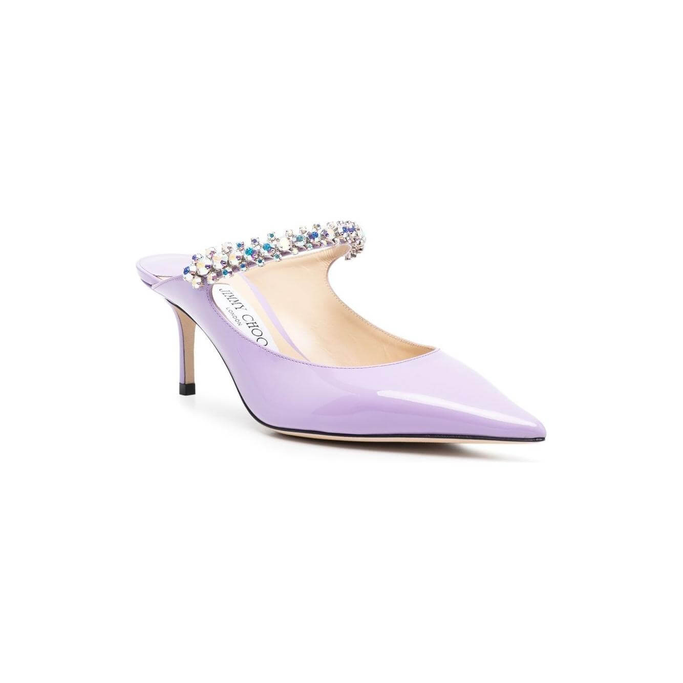 Jimmy Choo Bing Mules in lilac patent leather with crystal embellishments, pointed toe, and 65mm stiletto heel.