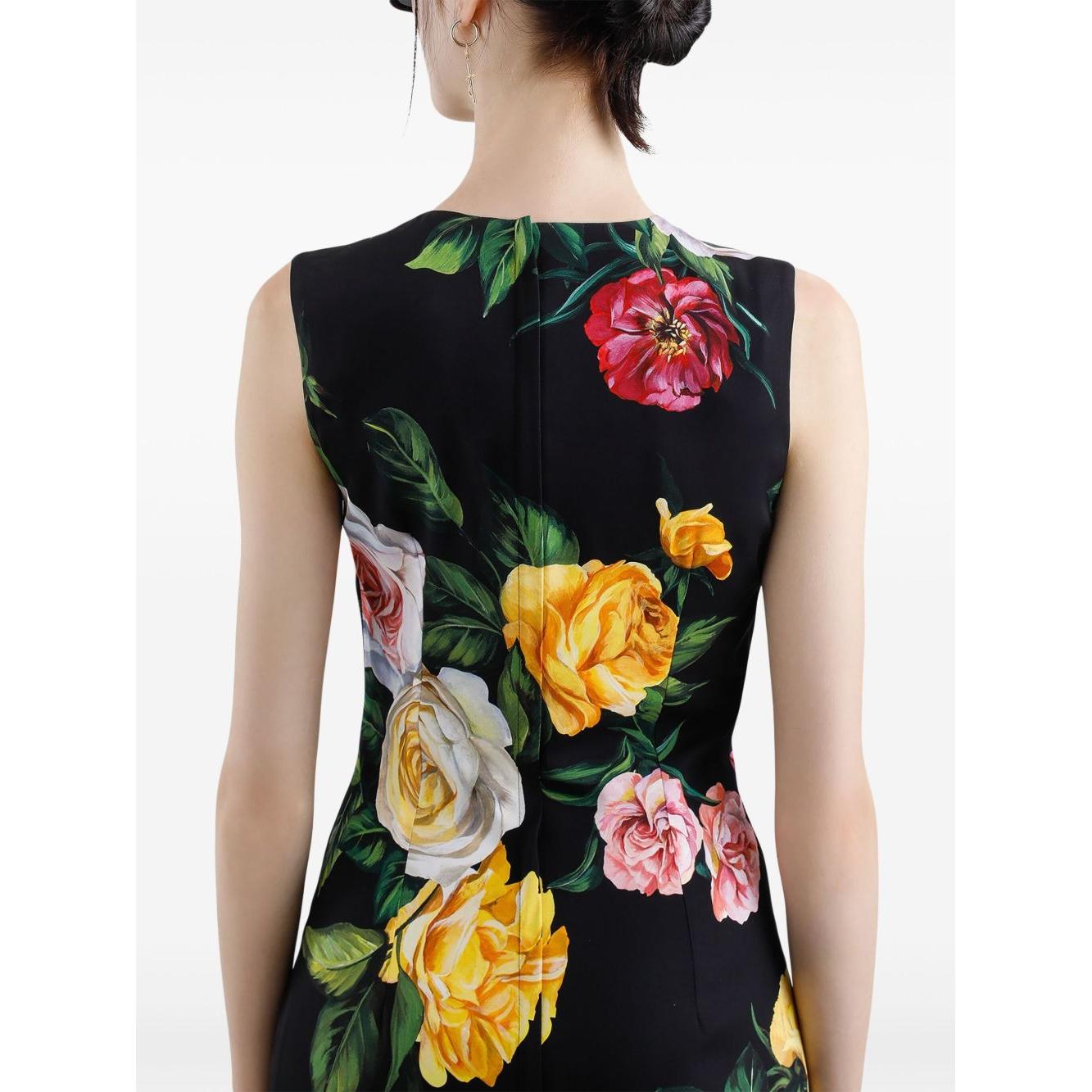 Back view of Dolce & Gabbana floral print midi dress in black with colorful roses, sleeveless design, rear fastening detail.