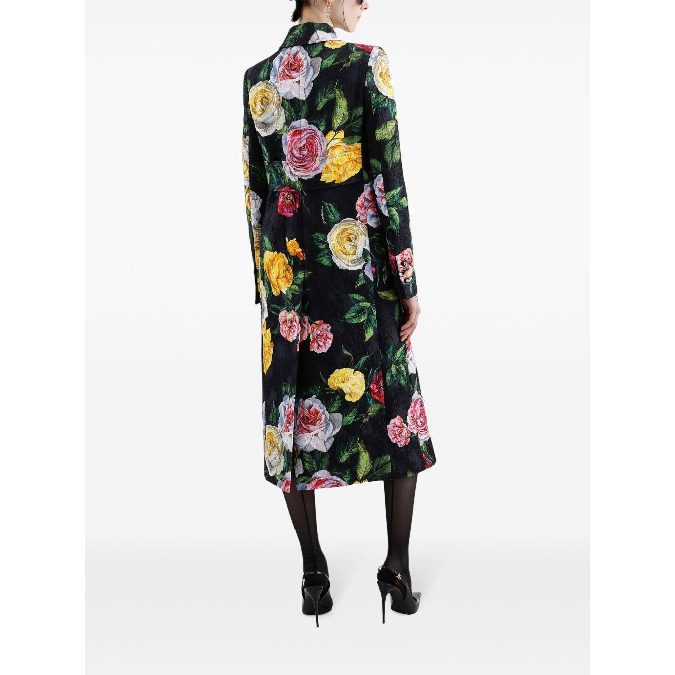 Back view of a Dolce & Gabbana black floral print midi dress with round neck and sleeveless design, model wearing heels.