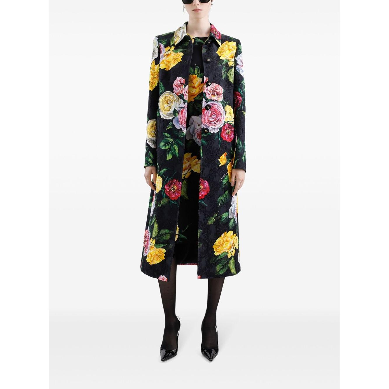 Model wearing Dolce & Gabbana floral print black midi dress with concealed fastening, round neck, sleeveless design.