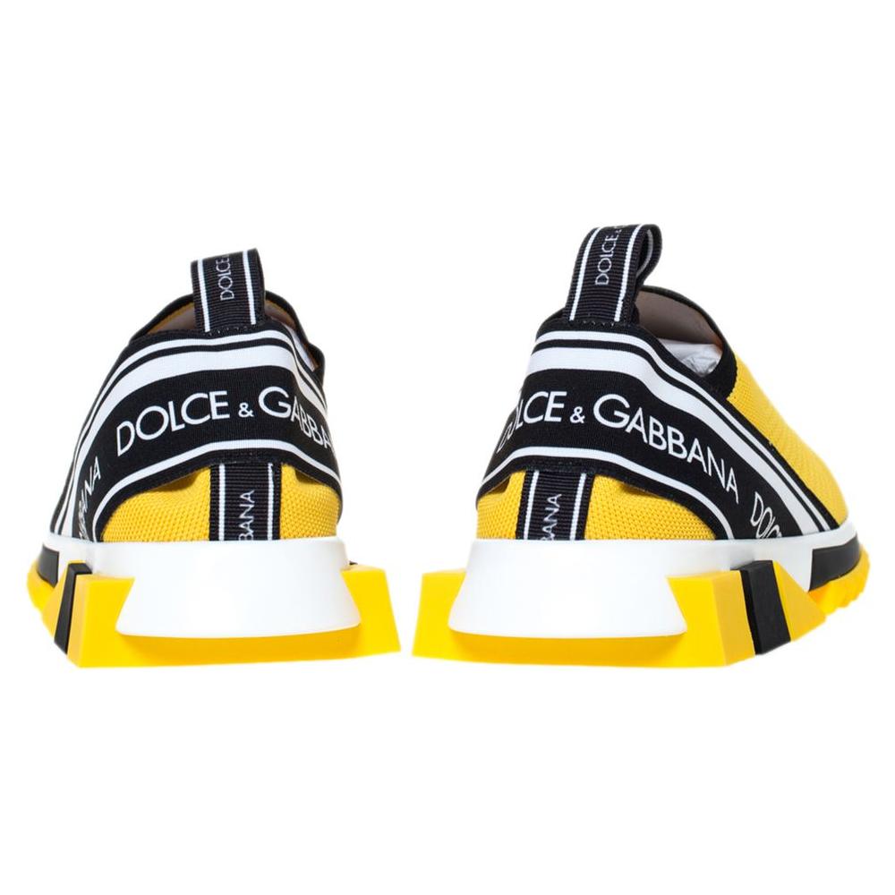 Dolce & Gabbana vibrant yellow stretch sneakers with chic logo print and robust rubber sole, rear view.