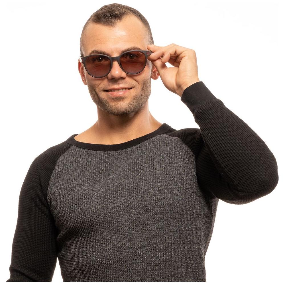 Man wearing BMW brown round sunglasses with mirrored gradient lenses