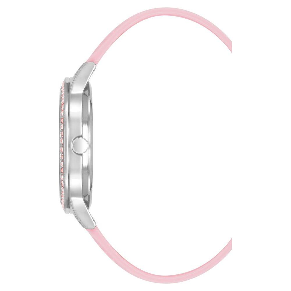 Side view of Juicy Couture silver women’s watch with pink silicone strap and rhinestone facing; quartz analog design.