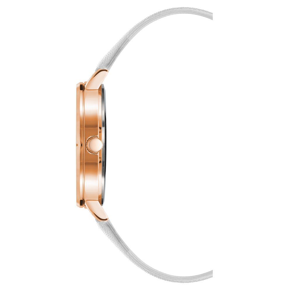 Side view of Juicy Couture gold women's watch with white leatherette strap and rhinestone face, quartz movement, and analog display.