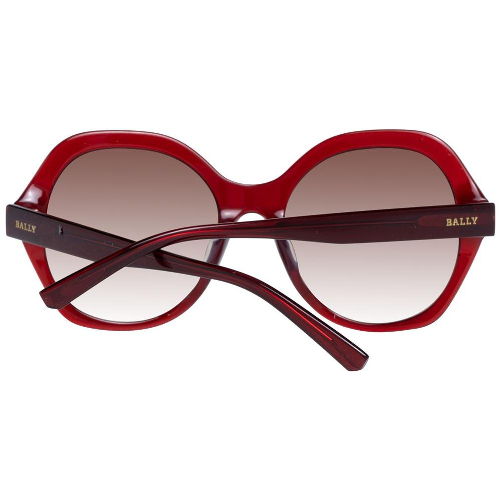 Bally red women's oval sunglasses with gradient brown lenses and full-rim plastic frame, includes branded case, 100% UVA & UVB protection.