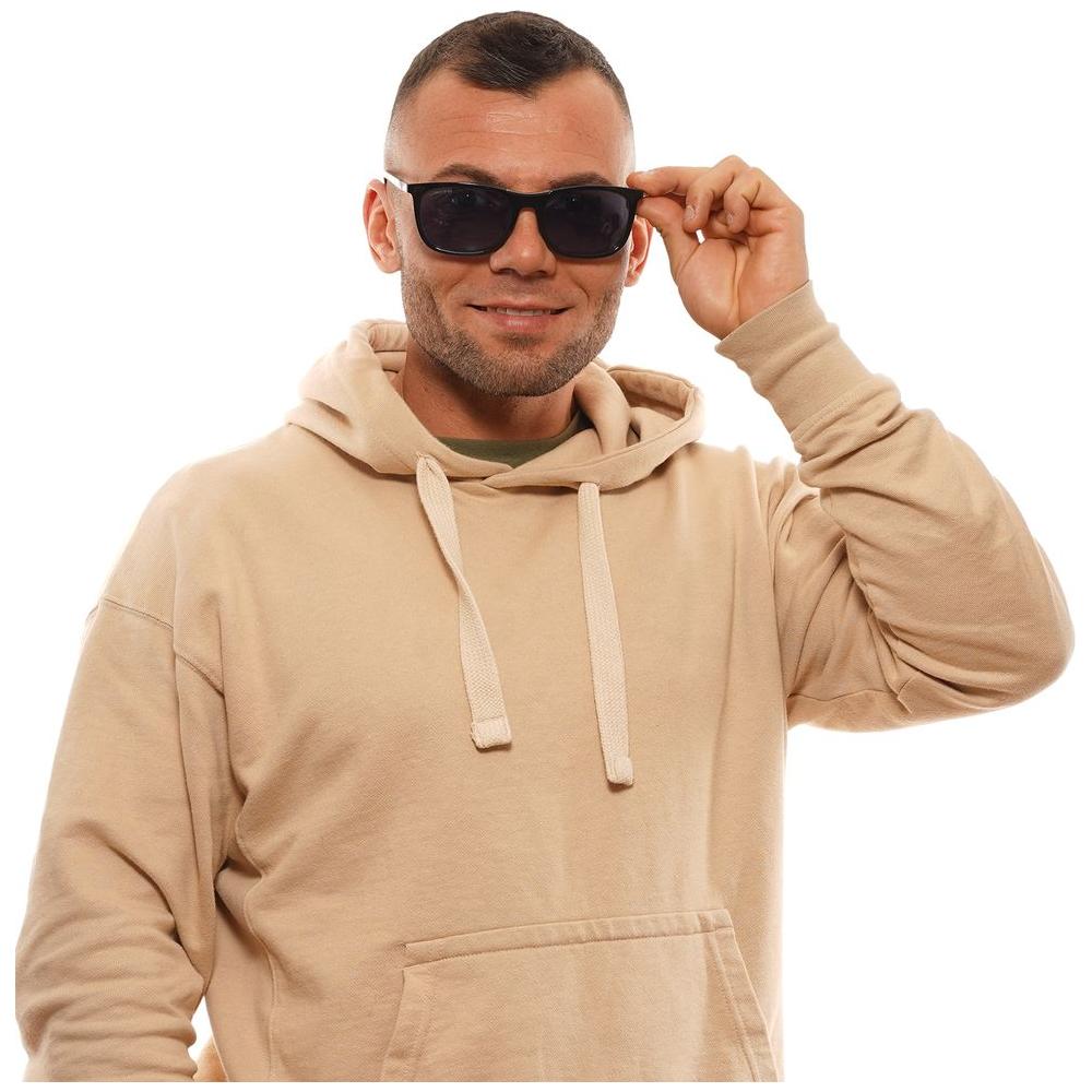 Man wearing Longines black sunglasses with blue lenses and full-rim design, showcasing stylish rectangle frames for optimal UV protection.