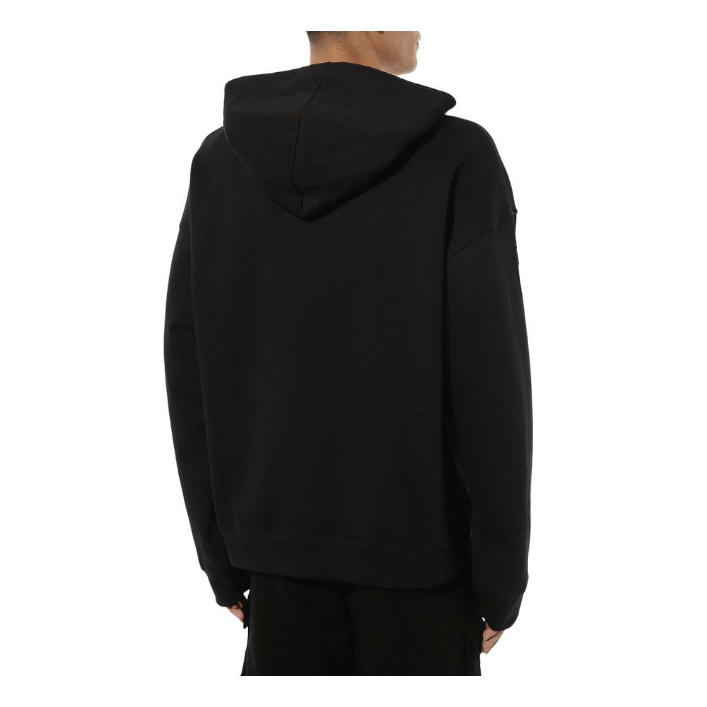 Back view of Comme Des Fuckdown black cotton hoodie with attached hood.