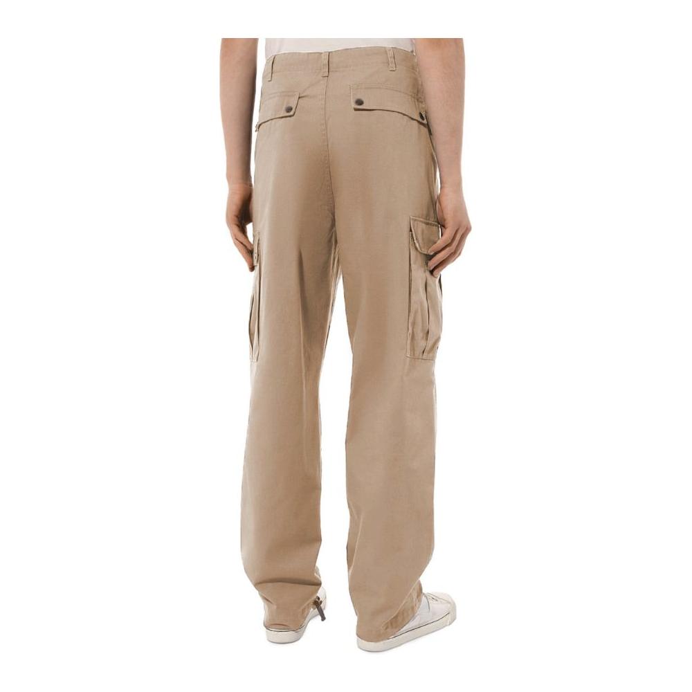 Back view of Comme Des Fuckdown beige cotton cargo trousers with front, side, and back pockets, button zip fastening, drawstring ankles.
