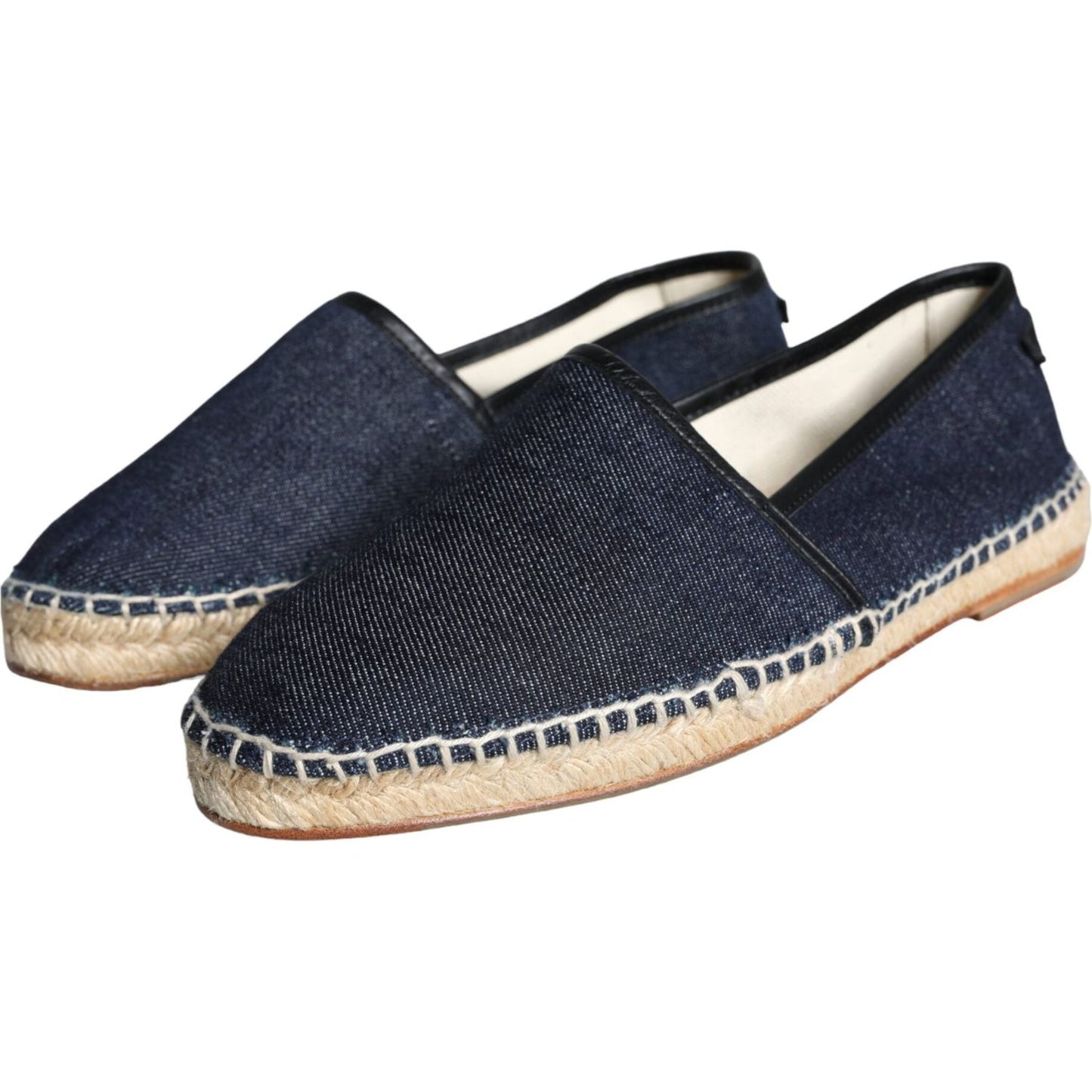 Dolce & Gabbana blue denim espadrilles with black leather trim and rubber soles, crafted in Italy. Luxury cotton shoes with logo detail.