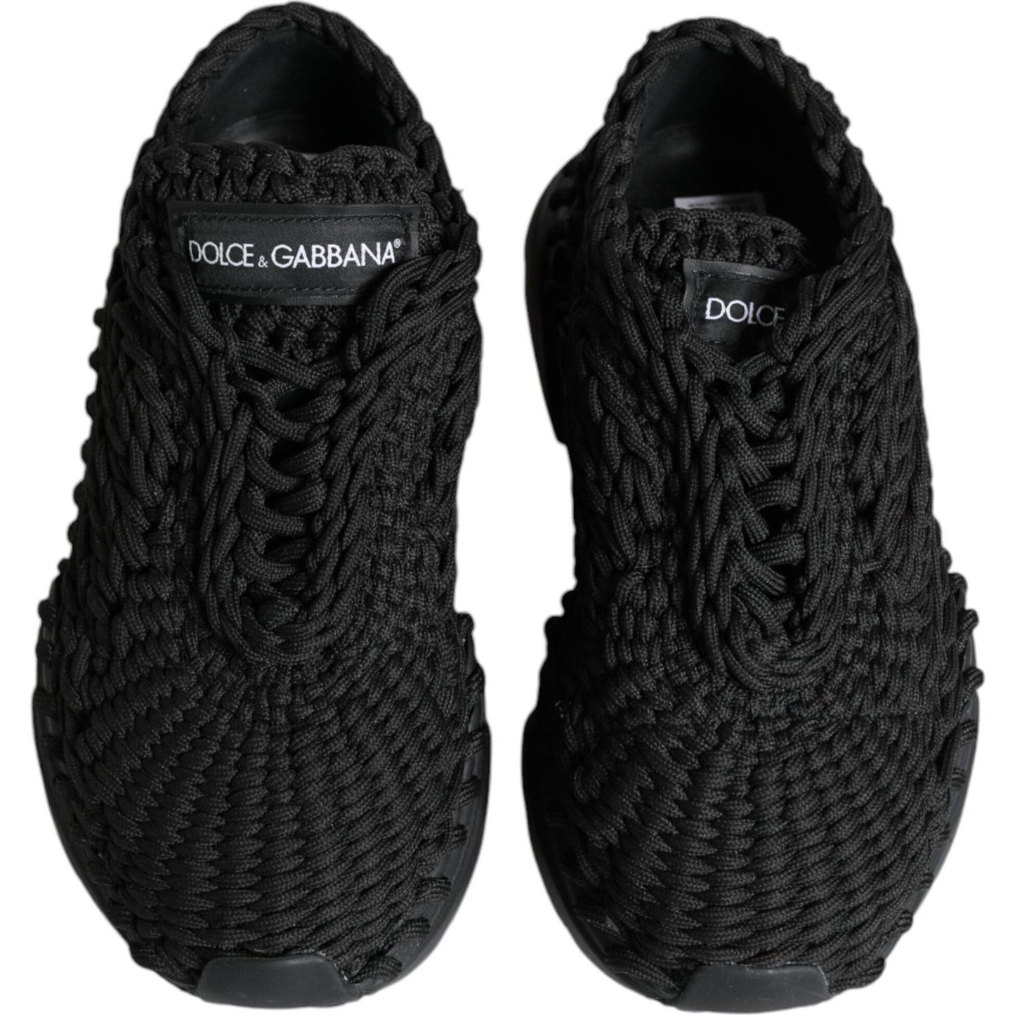 Dolce & Gabbana black knitted Daymaster sneakers, front view, featuring logo details and lace-up closure, made in Italy.