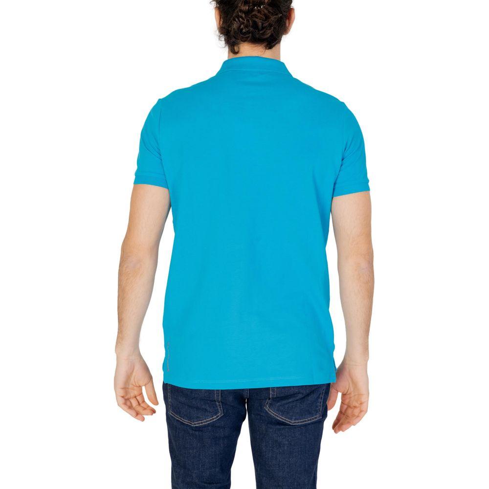 Back view of man wearing U.S. POLO ASSN. blue cotton polo shirt showcasing short sleeves and classic design.