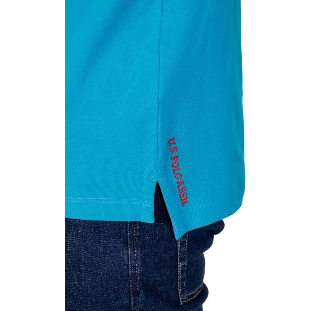 U.S. Polo Assn. blue cotton polo shirt with red embroidered logo on hem, ideal for casual style and comfort.