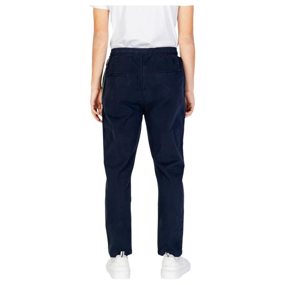 Rear view of a model wearing Gianni Lupo blue cotton men's pants, suitable for fall/winter collection, made with 97% cotton, 3% elastane.