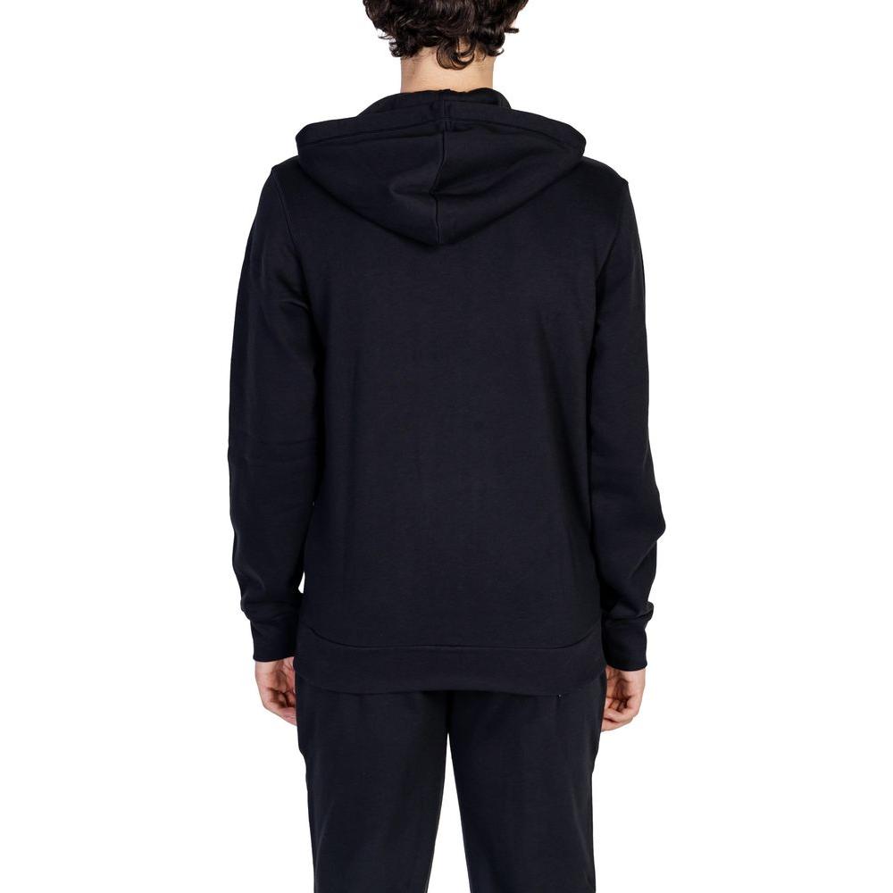 Back view of a man wearing the Emporio Armani Underwear black cotton sweater hoodie.