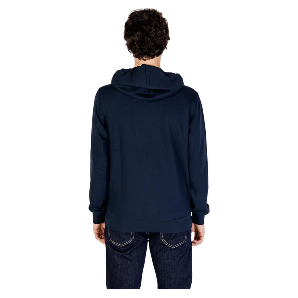 Back view of person wearing Emporio Armani Underwear blue polyester hoodie, model 112053 4F574, showcasing modern design and fit.