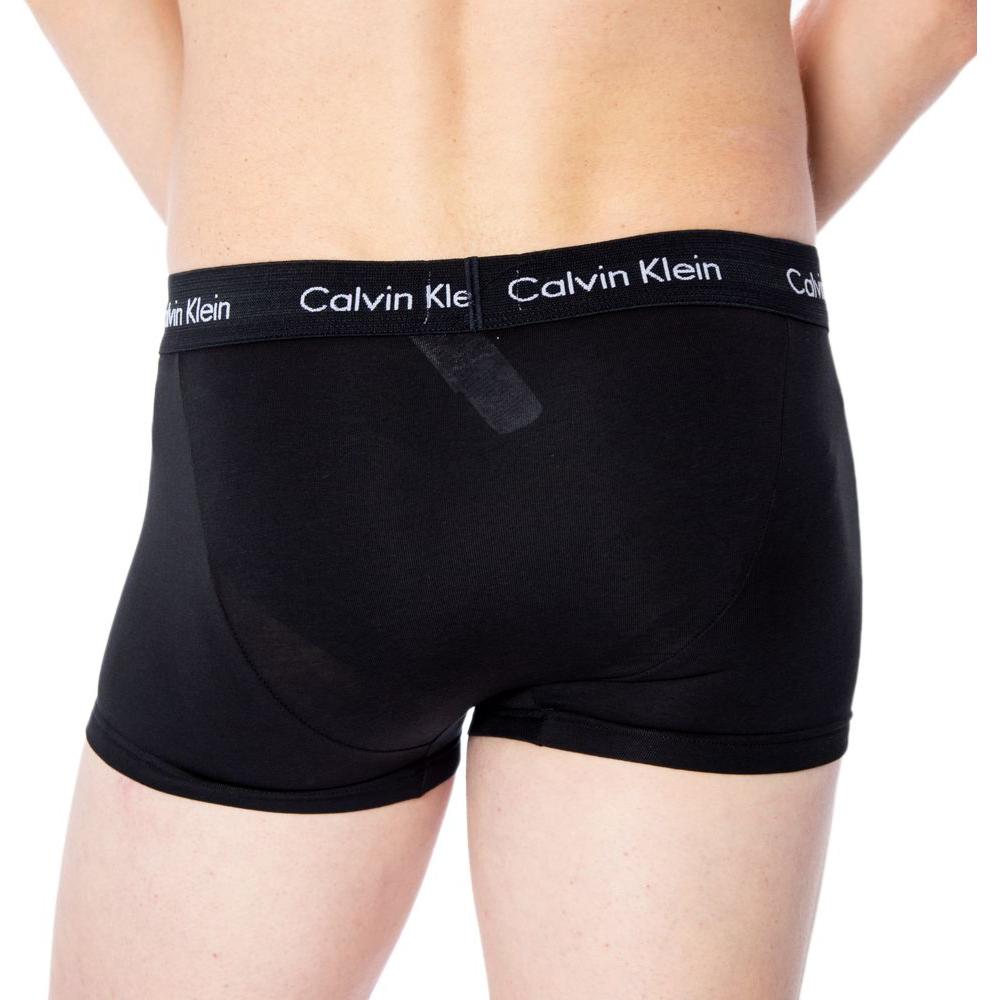 Back view of Calvin Klein men's black cotton boxer shorts with logo waistband, model U2664G, showcasing comfort and style.