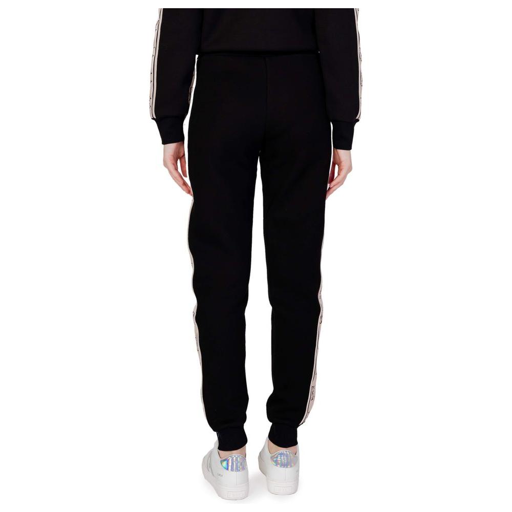 Back view of Guess Active Britney Jogger black sweatpants made of 100% cotton, highlighting comfort and stylish elastic waistband.