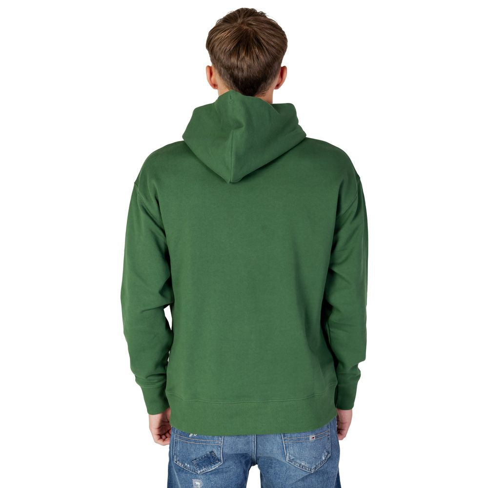 Back view of a man wearing a green Tommy Hilfiger cotton hoodie from the Autumn/Winter collection.