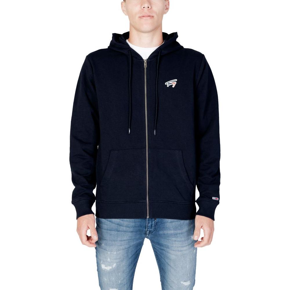 Men wearing Tommy Hilfiger blue organic cotton sweater from Fall/Winter collection, showcasing stylish recycled cotton hoodie design.