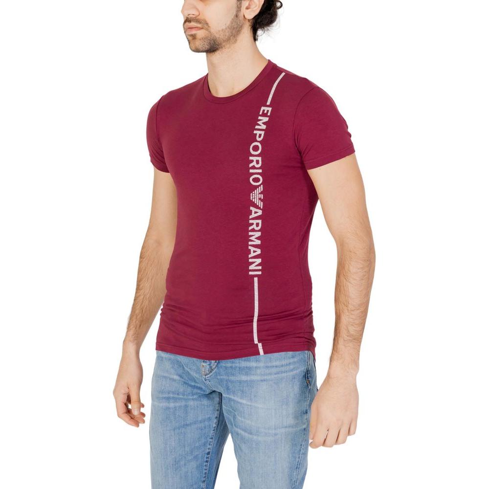 Man wearing Emporio Armani Bordeaux cotton t-shirt with side branding, round neck, paired with jeans, showcasing modern casual style.