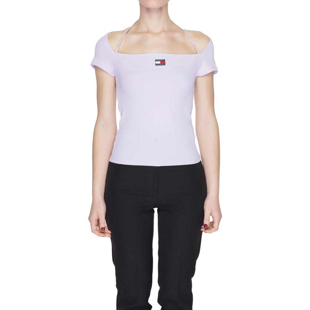 Woman wearing Tommy Hilfiger purple recycled polyester T-shirt, spring/summer collection, with logo and off-shoulder design.