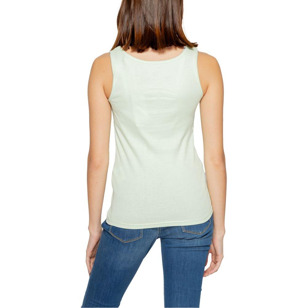Back view of a woman wearing a Guess turquoise cotton tank top, part of the spring/summer collection, showcasing casual fashion.
