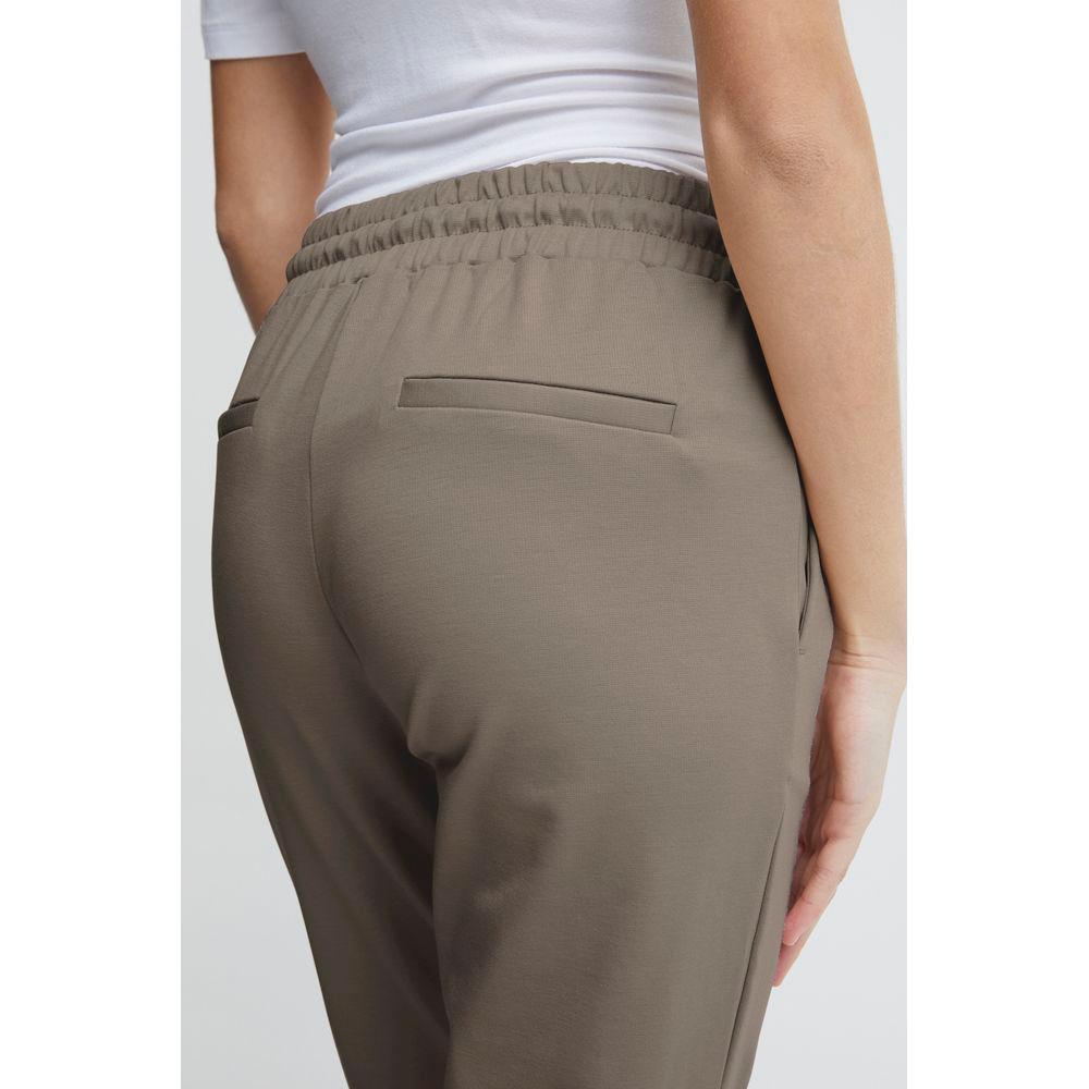 Back view of ICHI gray women's cigarette pants in polyester blend, featuring elastic waistband and pockets. Fall/Winter collection.