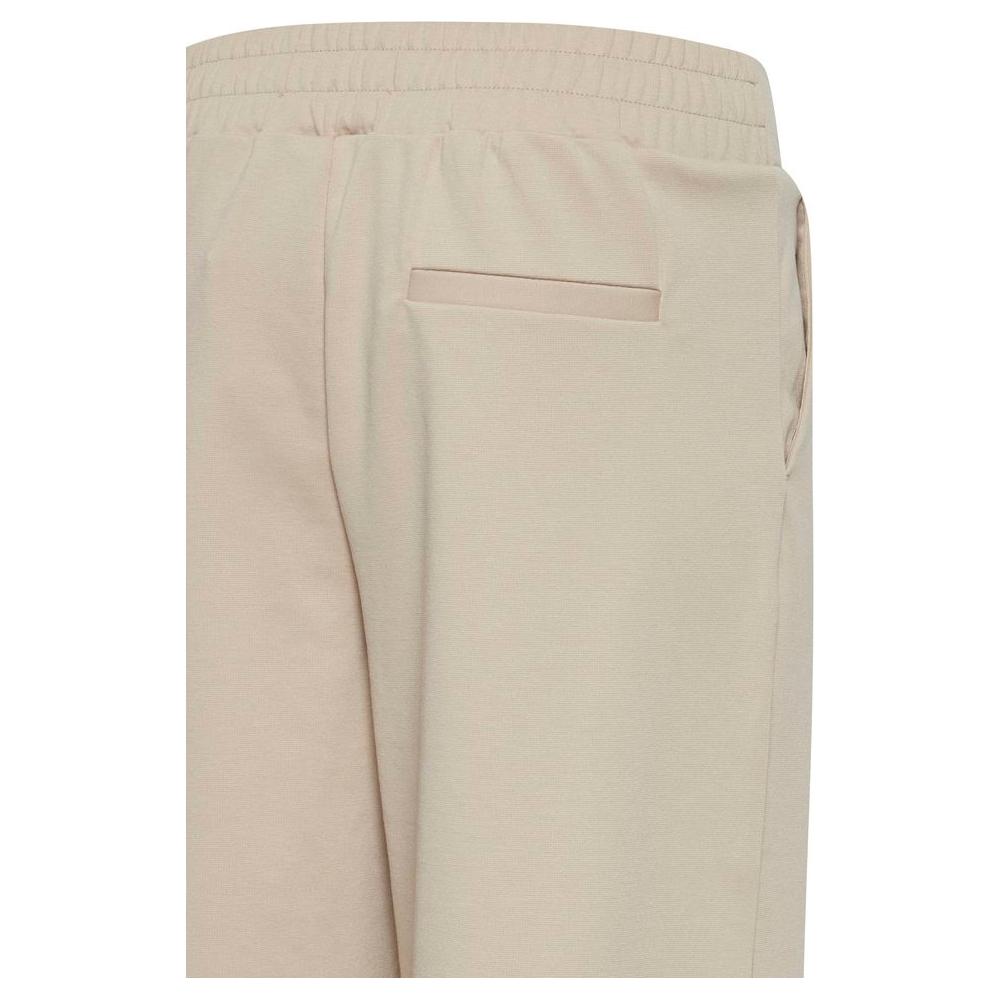 ICHI beige recycled polyurethane women's pants, close-up of back detail, part of Fall/Winter collection, sustainable fashion.