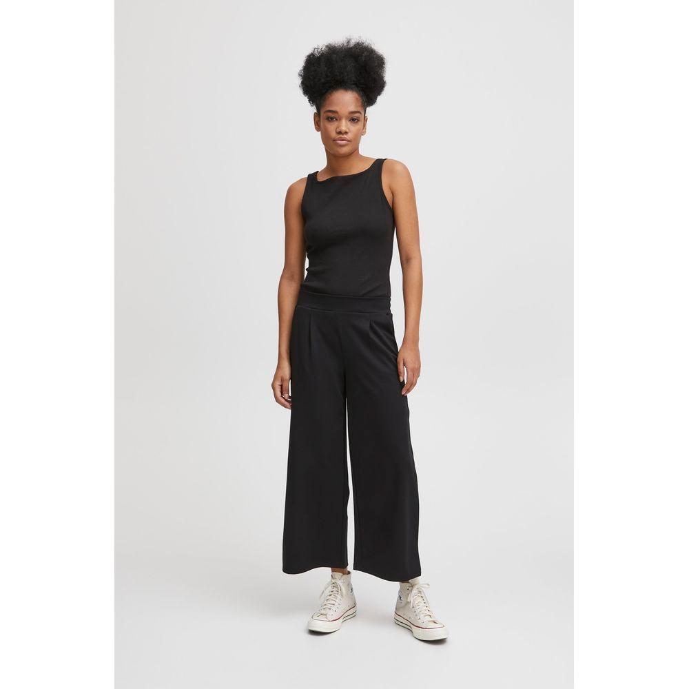 Woman wearing ICHI Black Recycled Polyester Bootcut Pants, Fall/Winter collection.