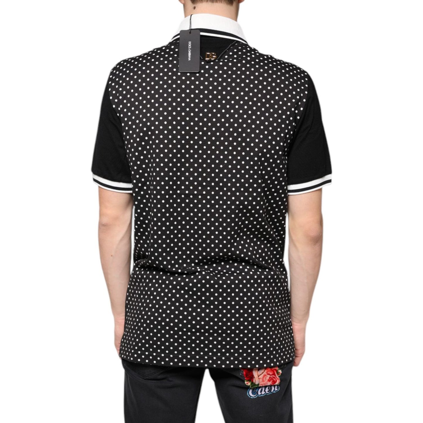 Back view of a Dolce & Gabbana black and white striped collared polo t-shirt with button closure and logo details.