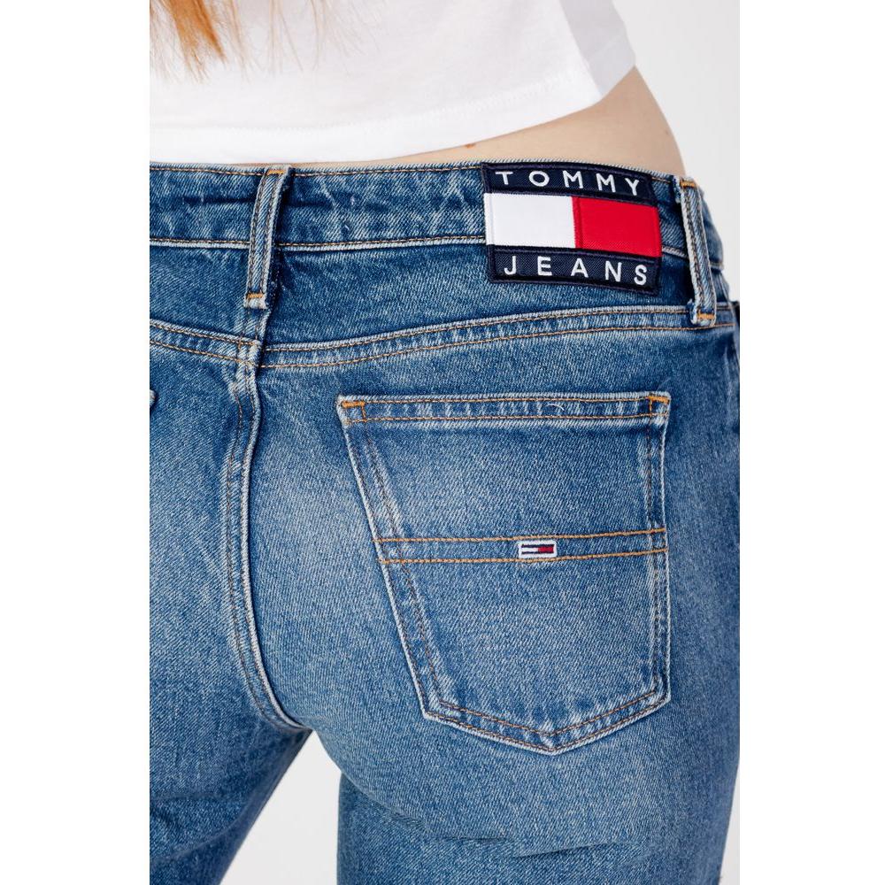 Close-up of Tommy Hilfiger blue baggy jeans for women, featuring a back pocket and logo patch. Ideal for fall/winter collection.