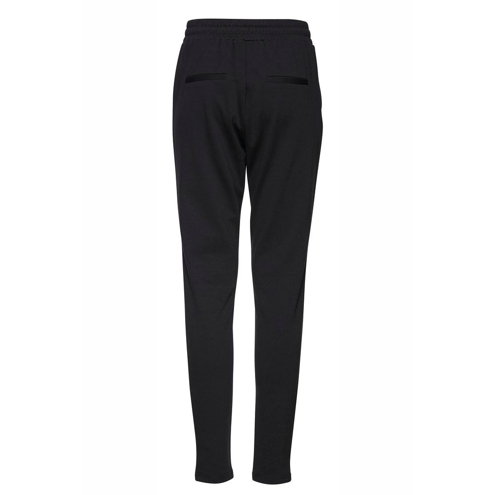ICHI black polyester women's cigarette pants, fall/winter collection, back view showing elastic waistband and pocket detail.