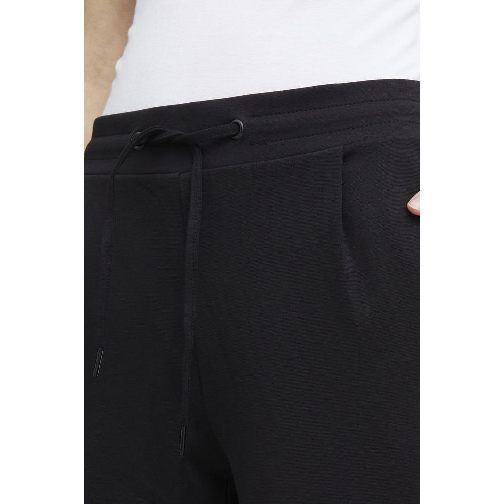 ICHI black polyester women's cigarette pants, fall/winter collection, close-up of elastic waistband and drawstring detail.