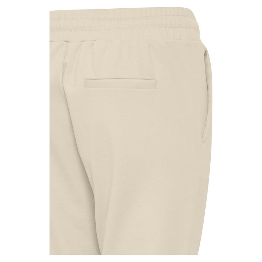Back view of ICHI beige women's cigarette pants, featuring polyester blend fabric ideal for fall and winter collections.