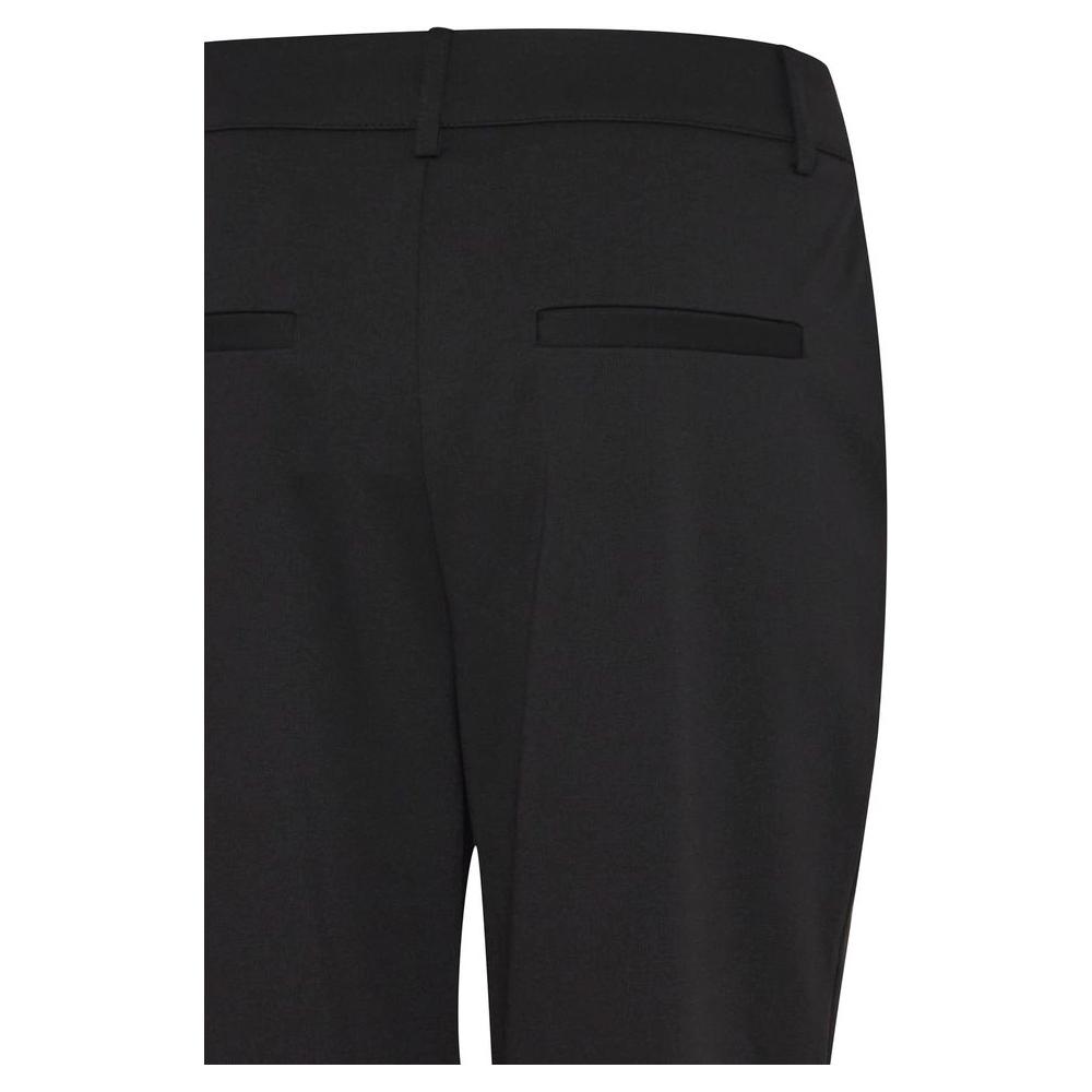 Back view of ICHI women's cigarette pants in black recycled polyester for fall/winter collection, showcasing pocket details.