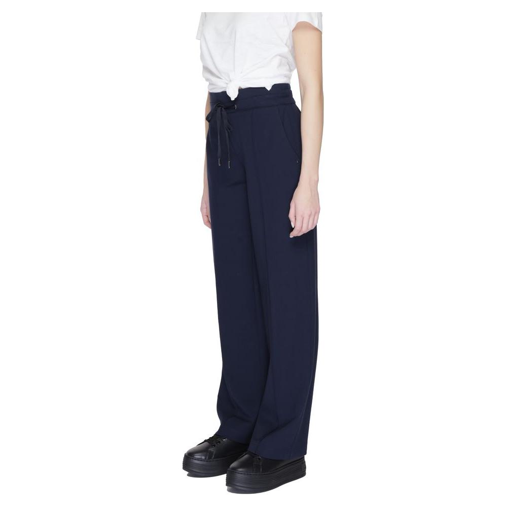 Woman wearing Street One blue viscose palazzo trousers, spring/summer collection, featuring a drawstring waist and wide leg fit.