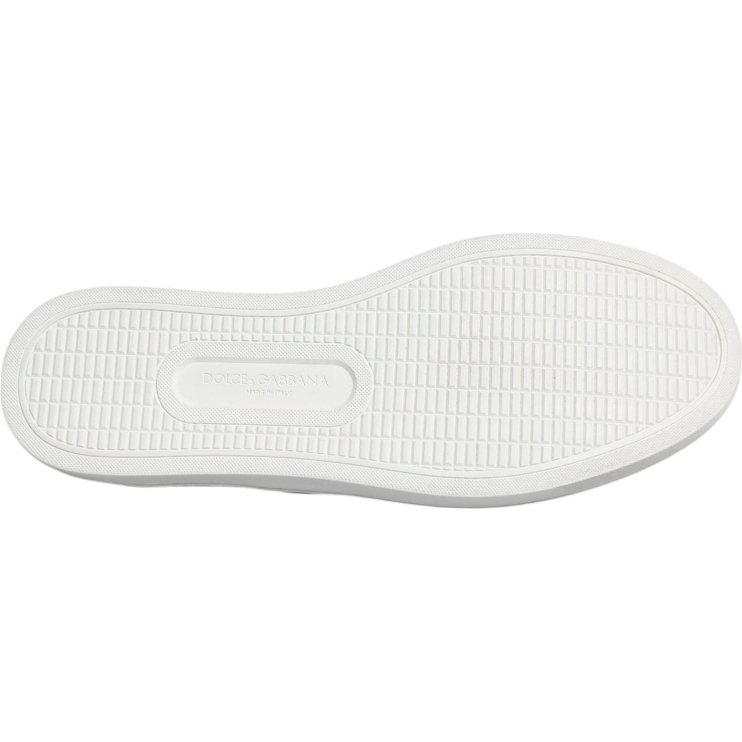 White rubber sole of Dolce & Gabbana blue croc leather sneakers, side view showcasing tread pattern. Made in Italy.