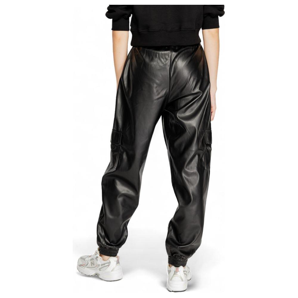 Women's black polyester pants, fall/winter collection, showcasing sleek design and comfortable fit, perfect for stylish outings.