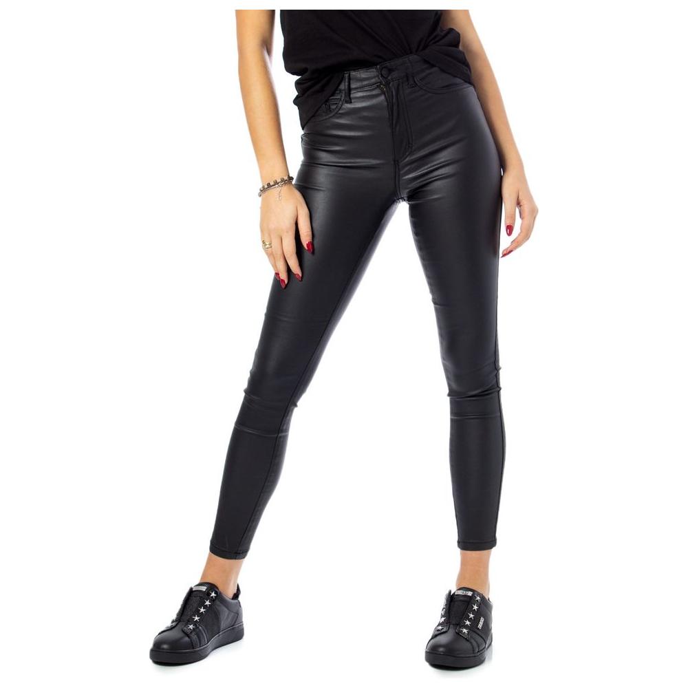 Woman wearing Only black viscose skinny jeans with high-waist and rock coated finish, showcasing a sleek and stylish look.