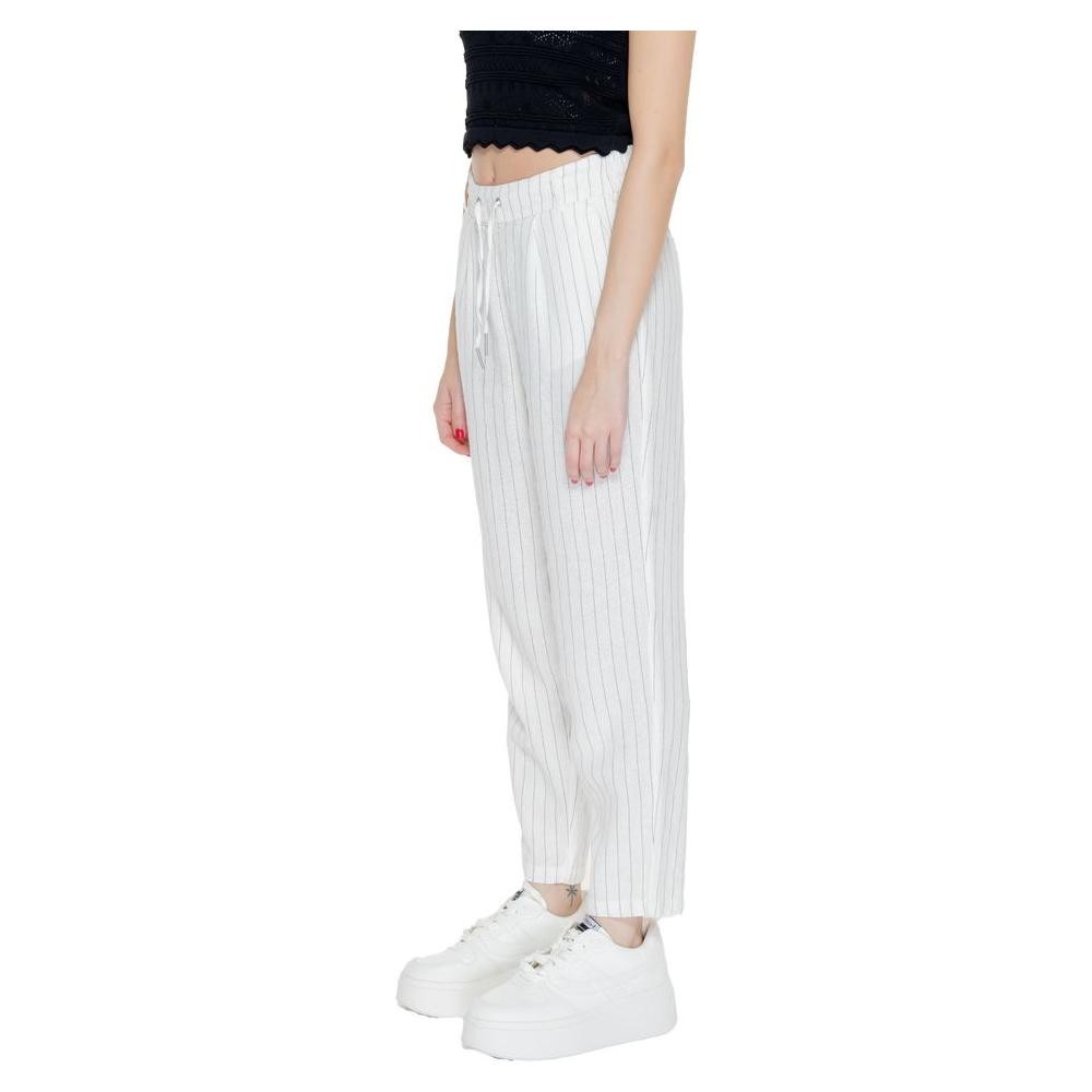 Women's regular white linen pants, spring/summer collection, made from 55% linen and 45% viscose, showcasing side profile.