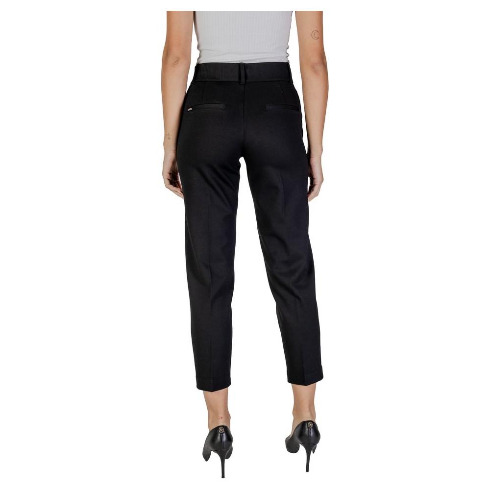 Back view of women's Street One black viscose pants, fall/winter collection, high waist, ankle length, elegant design.