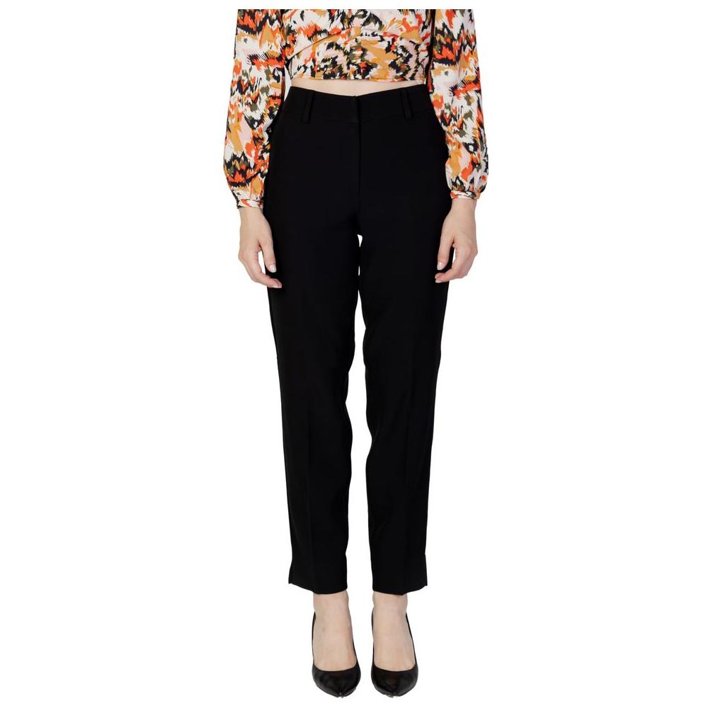 Women's black recycled polyester cigarette pants, autumn/winter collection, eco-friendly fashion with comfort fit and style.