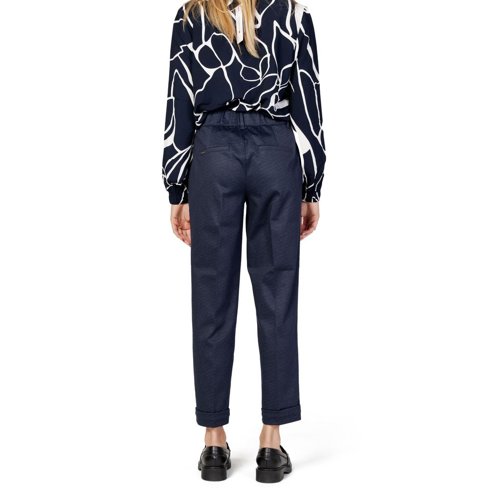 Woman wearing Street One blue viscose pants, fall/winter collection, back view, featuring a 47% viscose and 53% polyester blend.