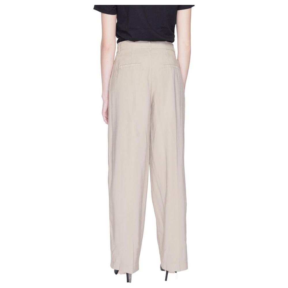 Back view of women's beige palazzo trousers, spring/summer collection, made from 93% Viscose LENZING™ ECOVERO™, 7% Polyester.