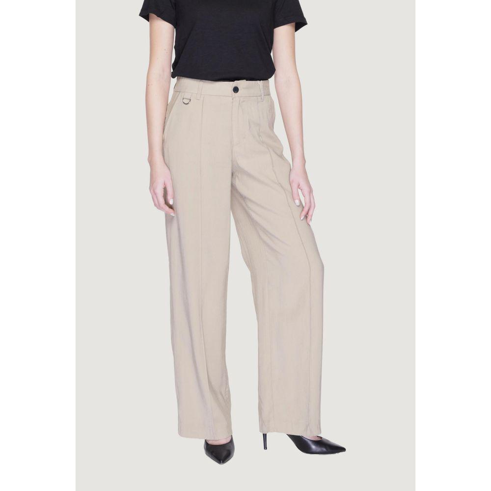 Women's beige palazzo trousers, spring/summer collection, made from viscose LENZING™ ECOVERO™ and polyester, styled with black top.