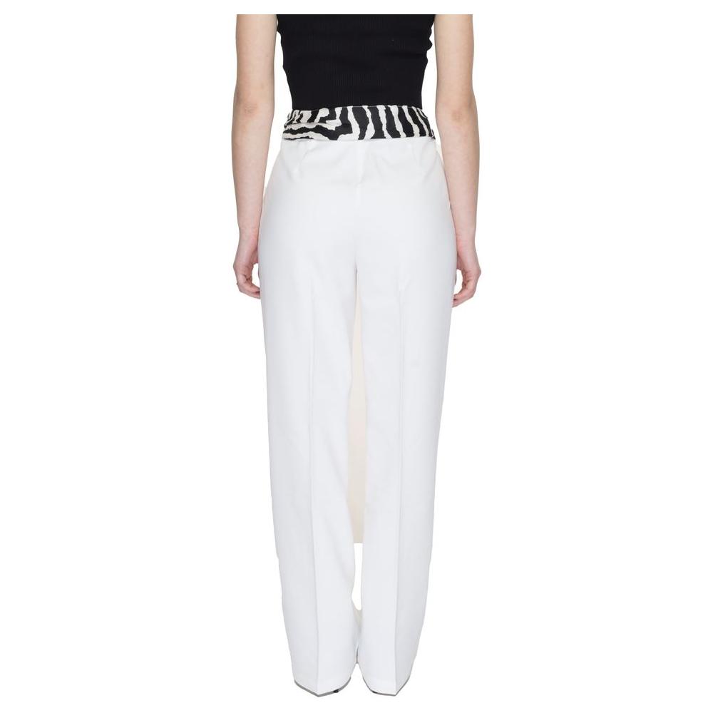 Back view of women's bootcut white polyester pants with black waistband from the Spring/Summer collection, featuring 11% elastane.