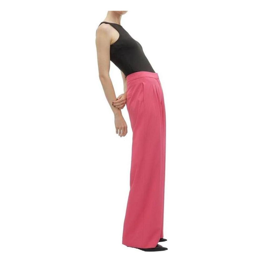Vero Moda women's pink palazzo pants, spring/summer collection, made of polyester and elastane, side view of model wearing black top.