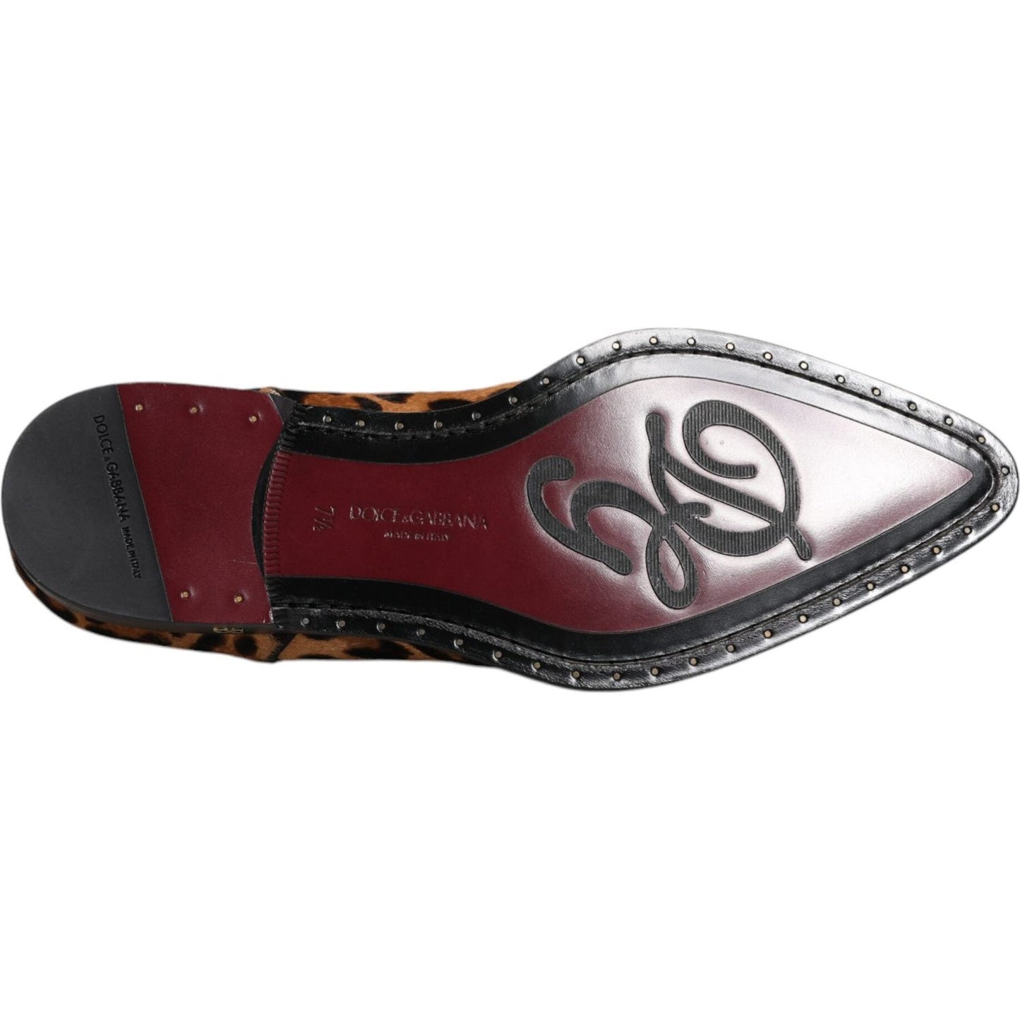 Sole of Dolce & Gabbana brown leopard derby dress shoe with logo detail, calf fur leather, and stud accents. Made in Italy.